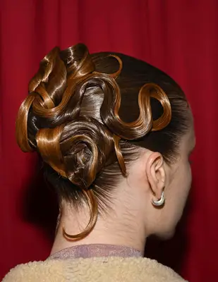 a sculptural hairdo at the Christian Siriano FW 2025 fashion show