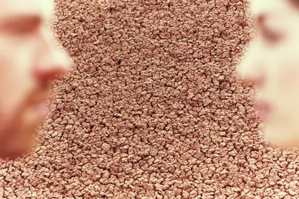 Young couple looking at each other, close-up, profile (composite)