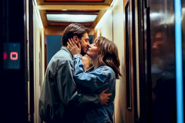 Happy Couple Kissing In The Elevator