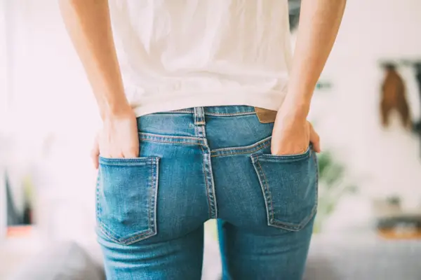 Rear view of young woman wearing jeans