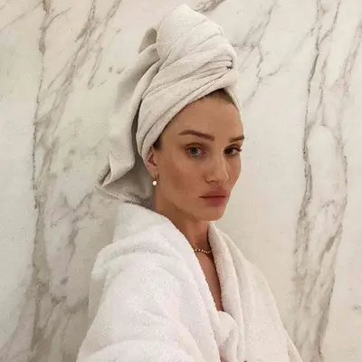 Rosie Huntington-Whiteley with a towel on her head 