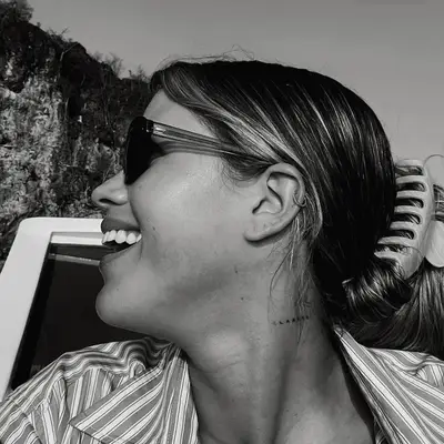 Keke Palmer with updo showing off Queen of Kush neck tattoo