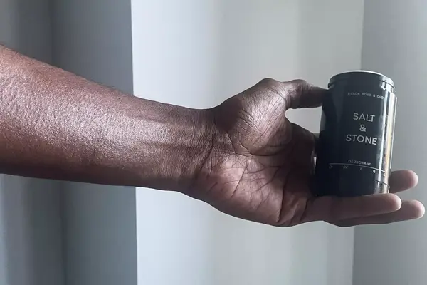 Person testing two natural deodorants