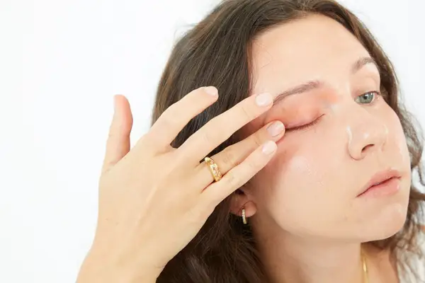 Person applying Drunk Elephant Slaai Makeup-Melting Butter Cleanser to eyelid 