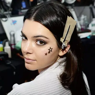 kendall jenner with temporary tattoo on face