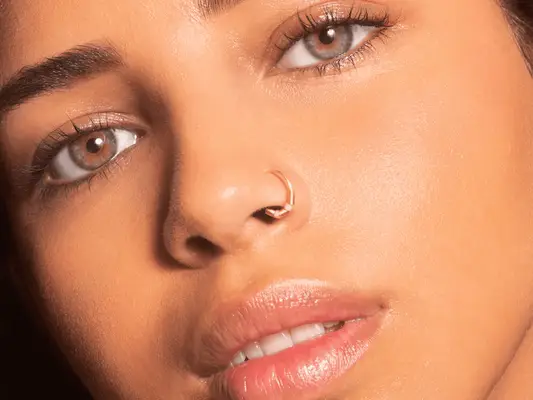 woman with nose hoop piercing
