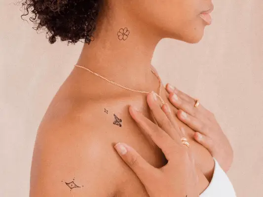 Close up of a woman with temporary tattoos