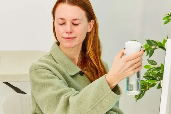 Person misting face with water
