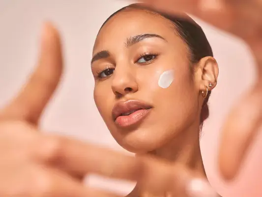 Model wearing Dr. Dennis Gross cream