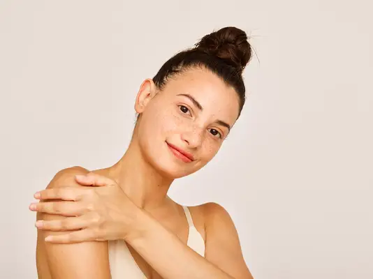 woman with hair tied up in a bun