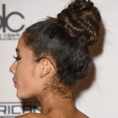Back of neck word tattoo on Ariana Grande
