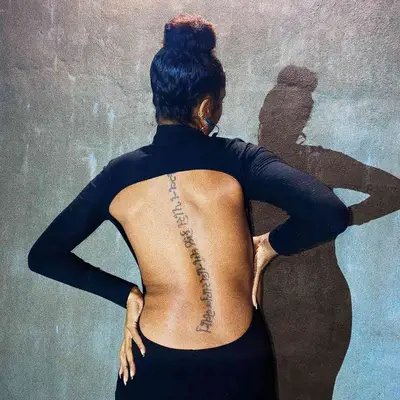 Tattoo of symbols along spine