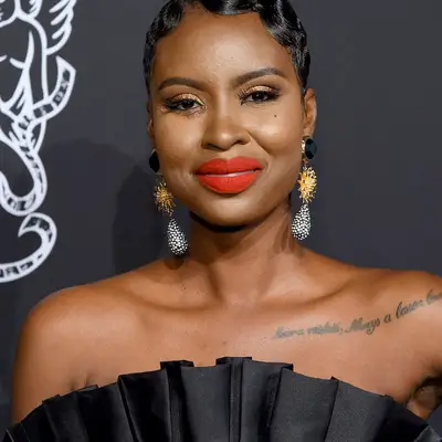 Wraparound word tattoo on Shannica Ewart