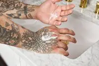 Bevel Body Lotion in a person