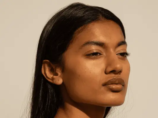 woman with firm jawline in sunshine