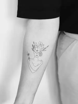 forearm with flower tattoo