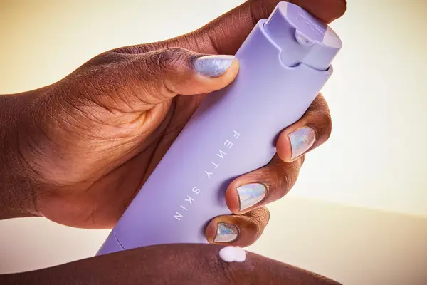 Hand showing a small amount of Fenty Skin Hydra Vizor Invisible Moisturizer Broad Spectrum SPF 30 Sunscreen