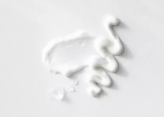 close up of cream texture on white background