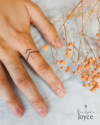 Two people with line and dot ring finger tattoos