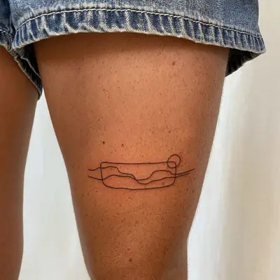 Single line tattoo of a landscape 