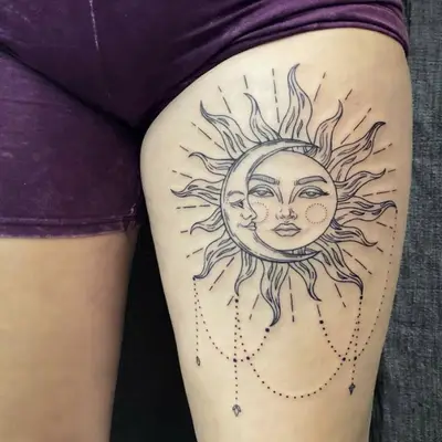 Sun and moon thigh tattoo
