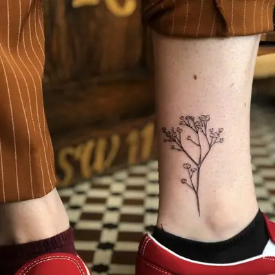 Branch tattoo on the ankle