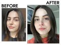 Hand holding up an opened tub of First Aid Beauty Ultra Repair Cream Intense Hydration