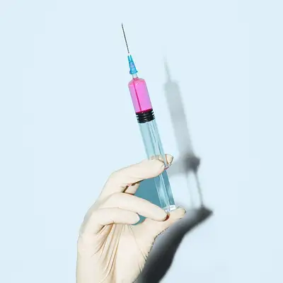 needle against blue background