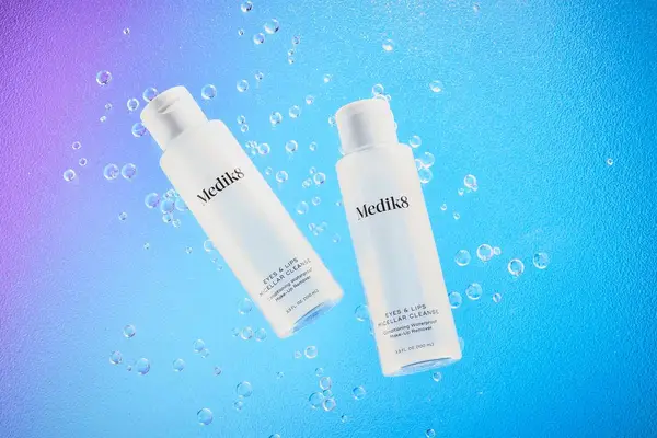 Medik8 Eyes & Lips Micellar Cleanser displayed on a colorful surface