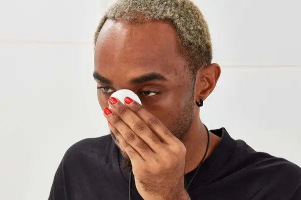 Person using cotton round on face