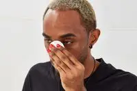 Person using cotton round on face