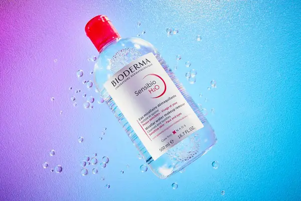 Collage of two people cleansing their faces with micellar water on a cotton pad