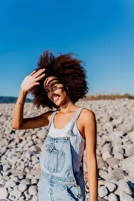person standing in the sun on the beach