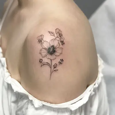 Circular flower and movement Shoulder Tattoo