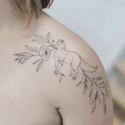 spread out animal and plant shoulder tattoo