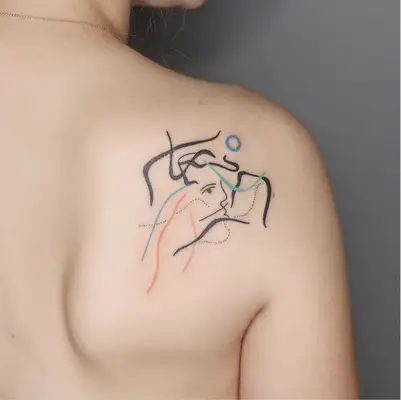 Abstract face and lines shoulder tattoo