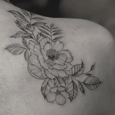 Shoulder tattoo with female figure line art design