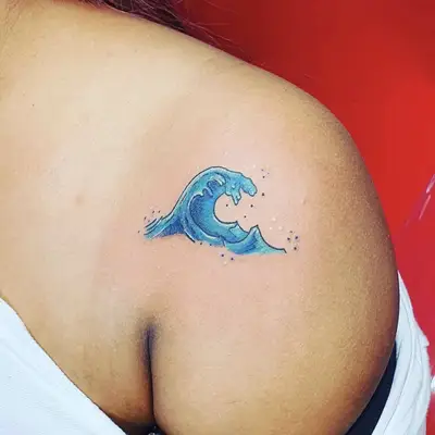 Tiny leaf and stem shoulder tattoo