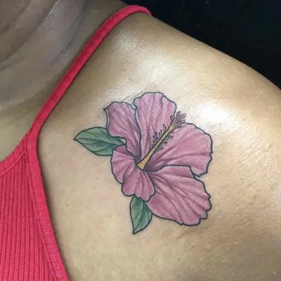 colored hibiscus flower shoulder tattoo