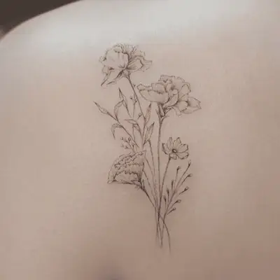 woman with salvador dali persistence of memory shoulder tattoo