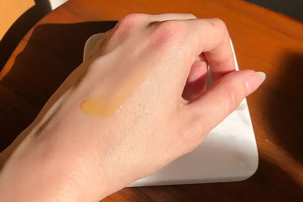 Closeup of SkinCeuticals C E Ferulic on back of hand