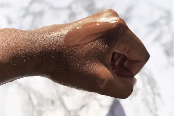 the ordinary alpha arbutin 2% + HA spread on the back of a hand