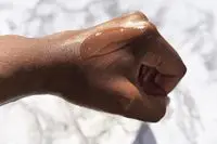 the ordinary alpha arbutin 2% + HA spread on the back of a hand