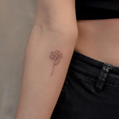 image of black ink fine line tattoo of flower