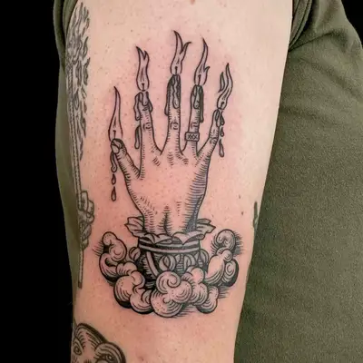 image of black ink fine line tattoo of hand with flames on each finger
