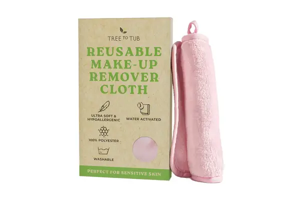 hand holding up Resorè Face Towel in packaging