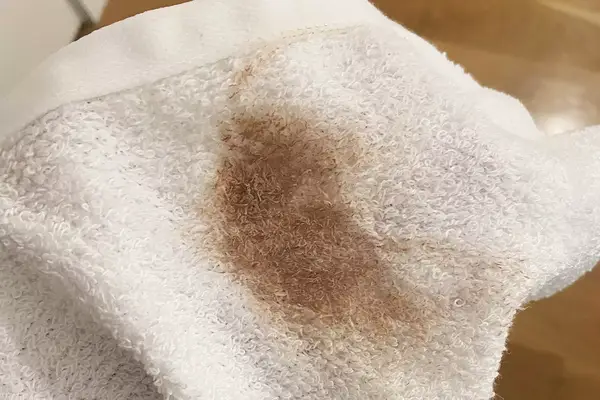 Amazon Basics Fast-Drying Absorbent Washcloth with makeup on it