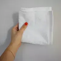 hand holding up Amazon Basics Fast-Drying Absorbent Washcloth