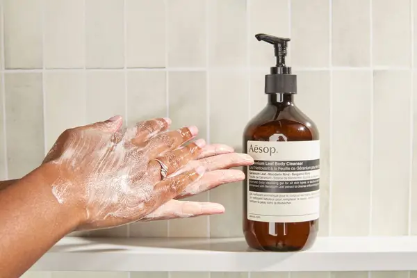 Person tests Aesop Geranium Leaf Body Cleanser on their hands