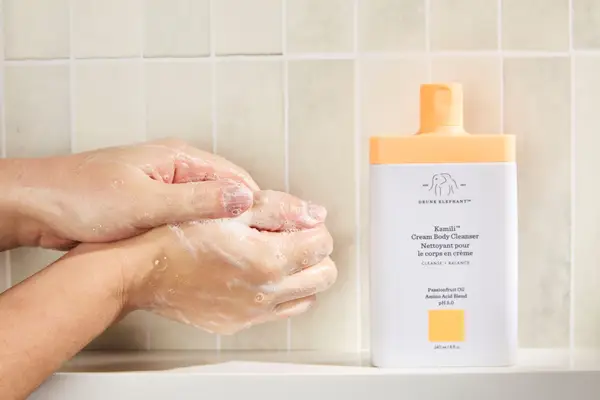 Person tests Drunk Elephant Kamili Cream Body Cleanser on their hands